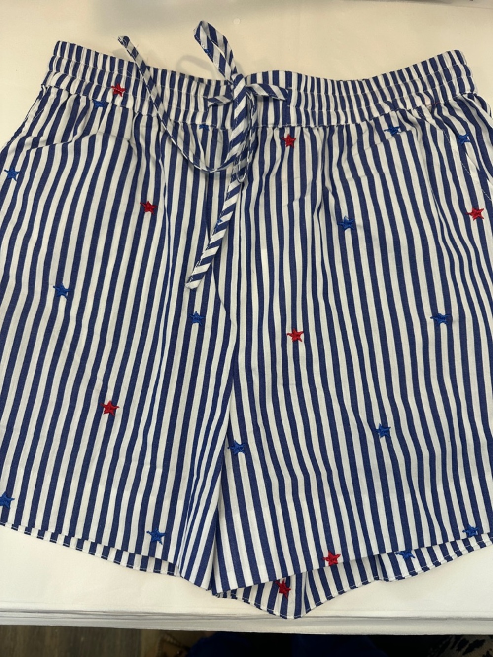 New with tags. Stars and Stripes shorts. Skies are blue. Embroidered